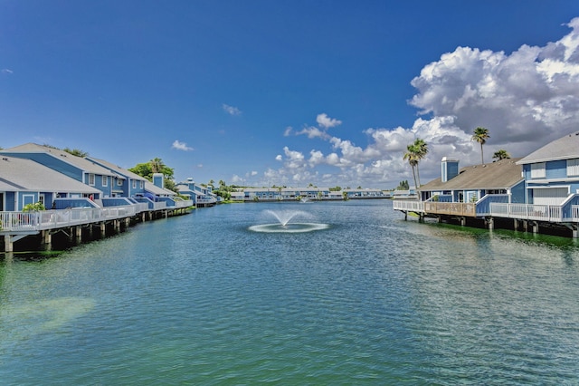 view of dock featuring a residential view and a water view