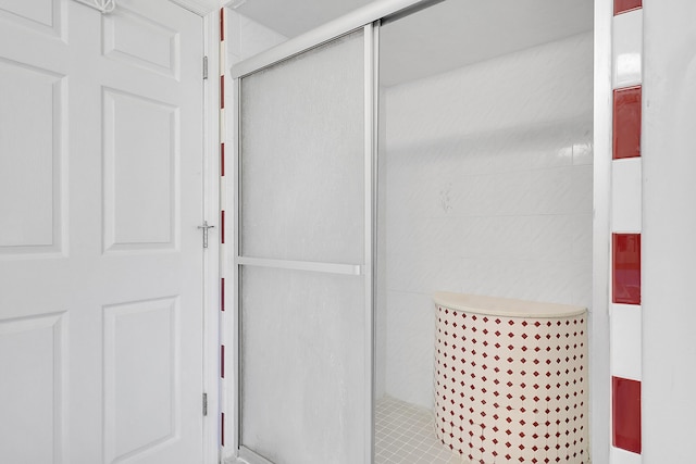 bathroom with a shower stall