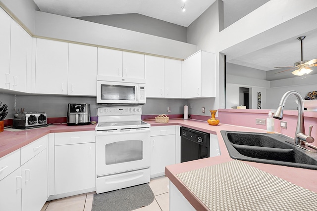 kitchen with light countertops, white appliances, a sink, and white cabinetry