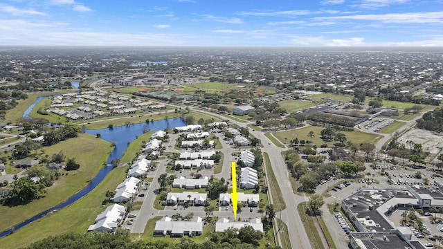 birds eye view of property featuring a water view and a residential view