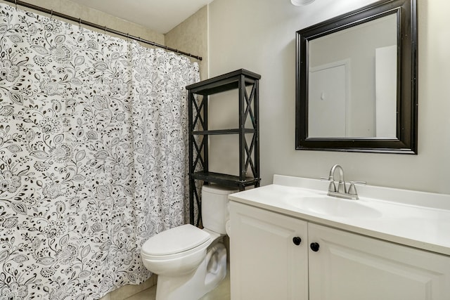 full bathroom featuring toilet, tile patterned floors, and vanity