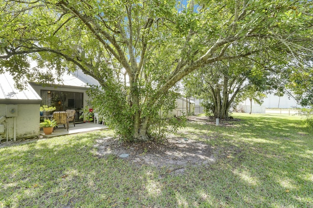 view of yard featuring a patio and fence