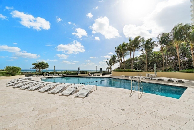 community pool featuring a patio area