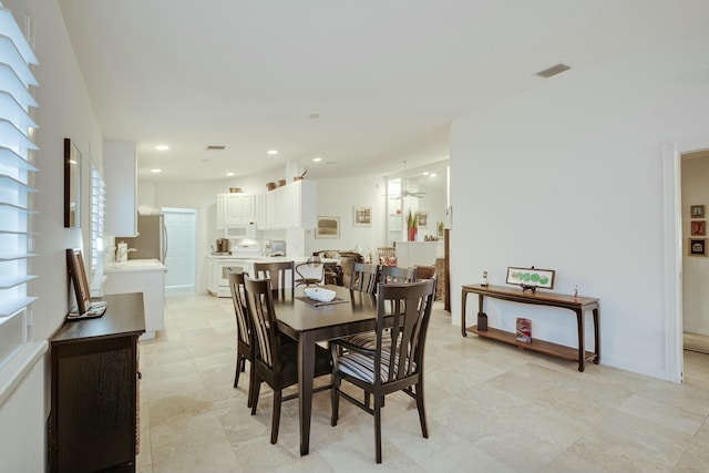 dining space featuring baseboards, visible vents, and recessed lighting