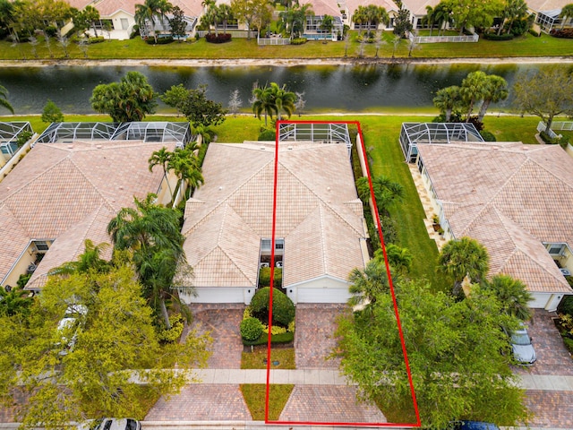 birds eye view of property featuring a residential view and a water view