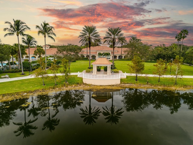 view of property's community featuring a gazebo, a yard, and a water view