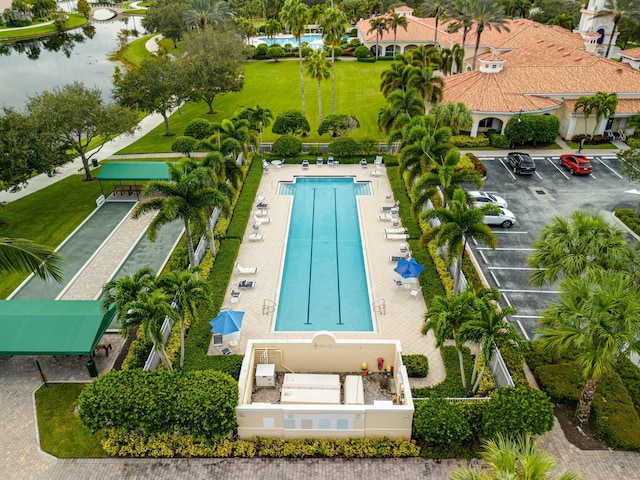 view of swimming pool with a water view