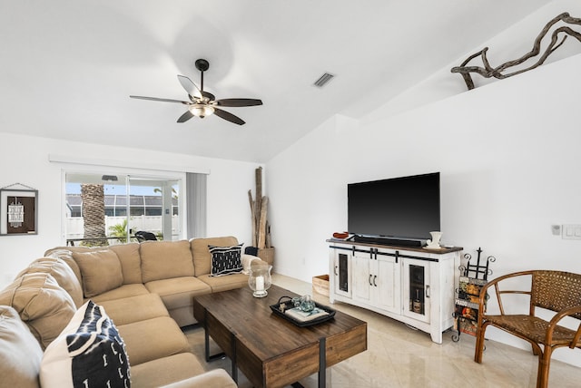 living room featuring lofted ceiling, ceiling fan, and visible vents