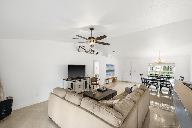 living area featuring vaulted ceiling, baseboards, and ceiling fan with notable chandelier