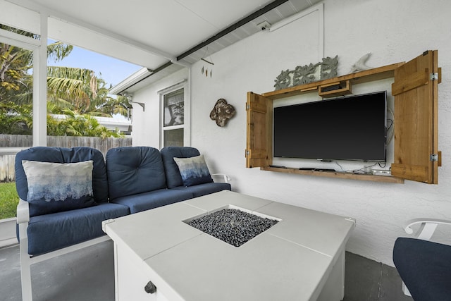 view of patio / terrace with a fire pit and fence