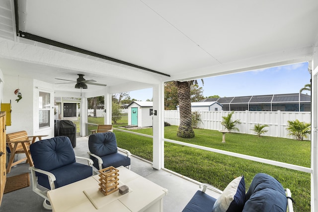 sunroom / solarium with ceiling fan