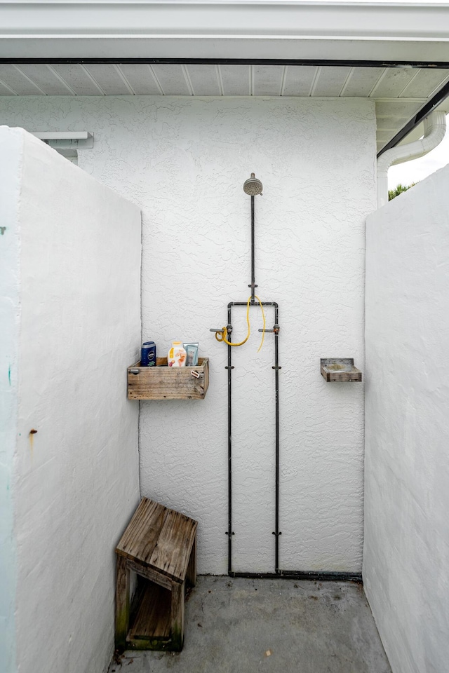 bathroom with unfinished concrete floors