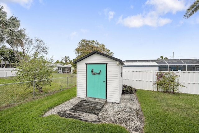 view of shed featuring a fenced backyard