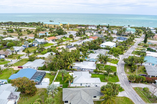 birds eye view of property with a water view and a residential view