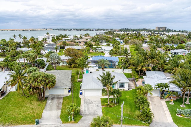 bird's eye view with a water view and a residential view