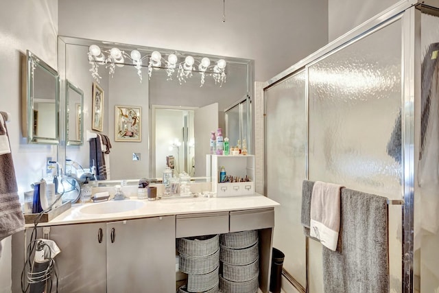 full bathroom with a shower stall and vanity