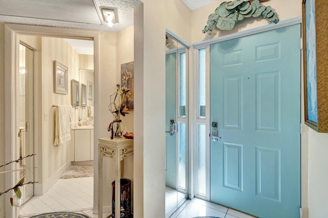 entrance foyer featuring light tile patterned floors