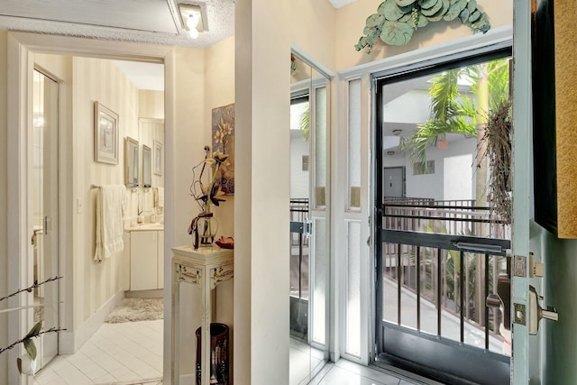 entryway featuring light tile patterned flooring