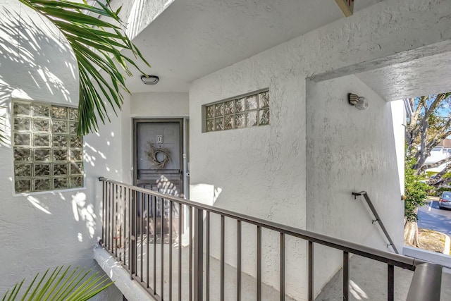 property entrance featuring stucco siding