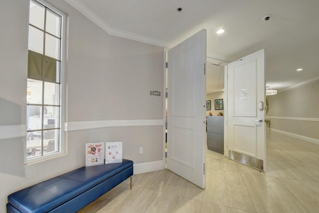 interior space with baseboards, recessed lighting, light tile patterned flooring, and crown molding