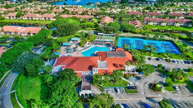 birds eye view of property featuring a water view and a residential view