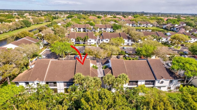 birds eye view of property with a residential view