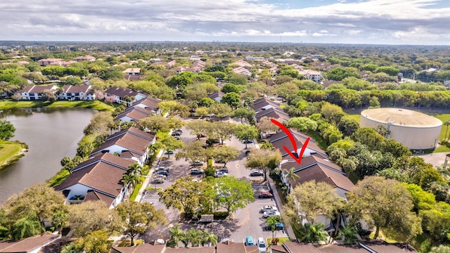 bird's eye view featuring a water view and a residential view