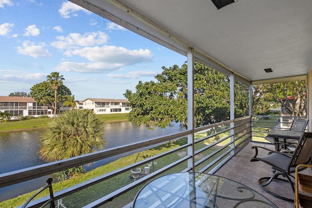 balcony featuring a water view