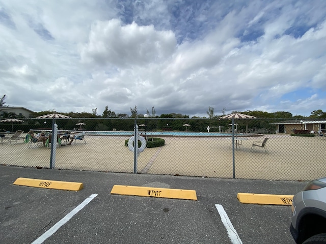 uncovered parking lot with fence