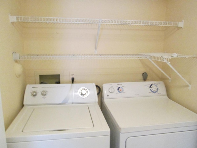 clothes washing area featuring washing machine and dryer