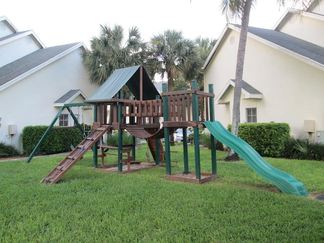 view of jungle gym with a lawn