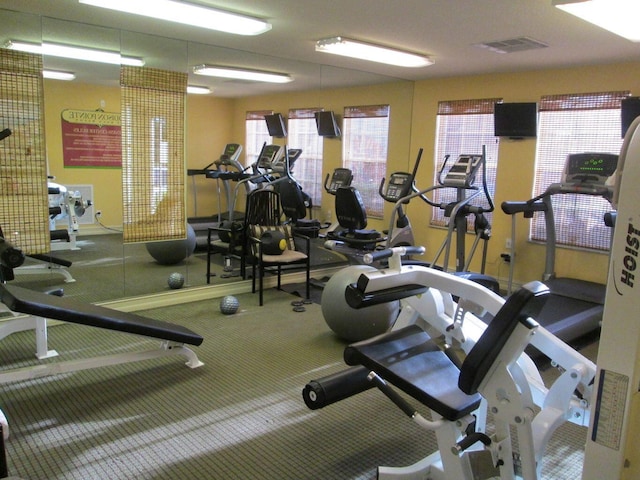 gym featuring carpet floors and visible vents