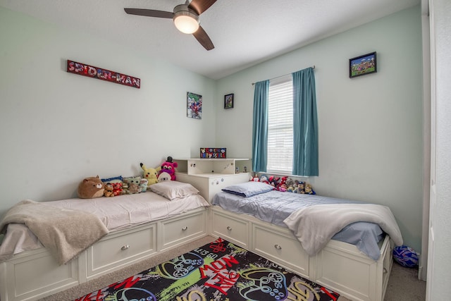 carpeted bedroom with a ceiling fan