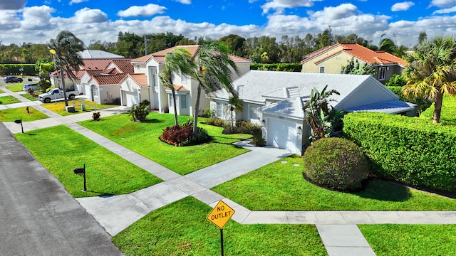 view of front of home with a front yard, driveway, a garage, a tiled roof, and a residential view