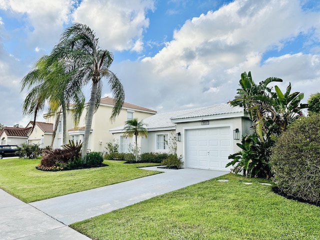 view of front of property with an attached garage, stucco siding, concrete driveway, and a front yard