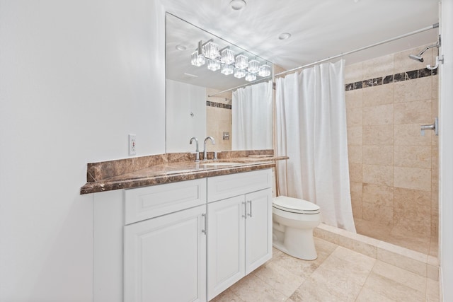 full bath featuring toilet, a shower stall, and vanity