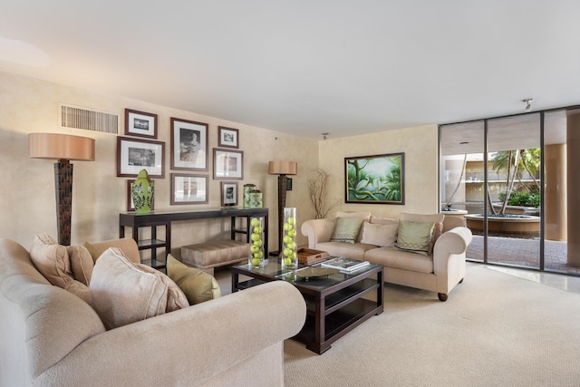 living area with light carpet and visible vents