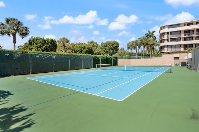 view of tennis court with fence