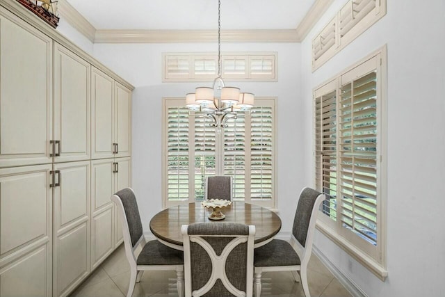 dining space with ornamental molding, light tile patterned floors, baseboards, and an inviting chandelier