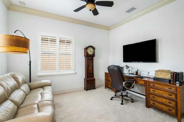 office featuring crown molding, light colored carpet, visible vents, a ceiling fan, and baseboards