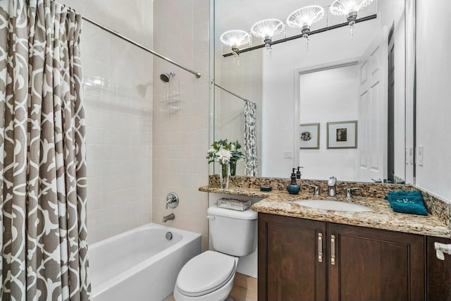 bathroom featuring shower / bath combo, vanity, and toilet