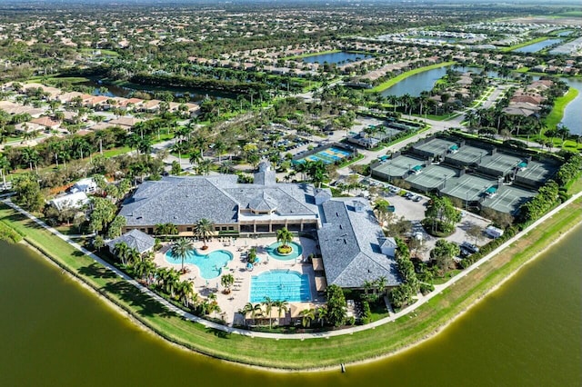 birds eye view of property with a water view