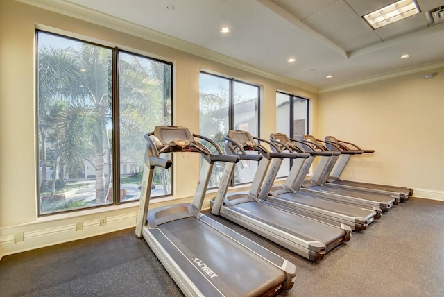 gym with recessed lighting, crown molding, and baseboards