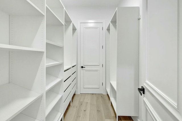 spacious closet with light wood-style floors