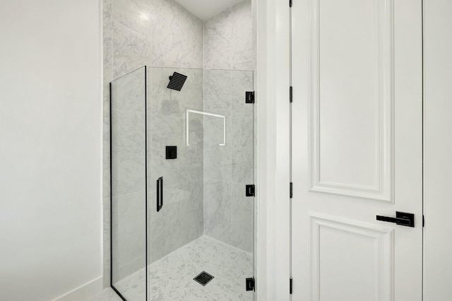 full bath with a shower stall