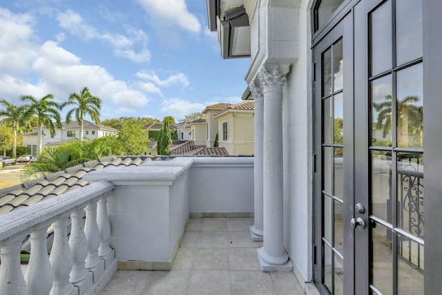 balcony featuring a residential view and french doors