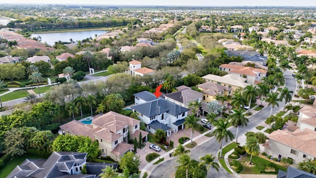 bird's eye view featuring a water view and a residential view