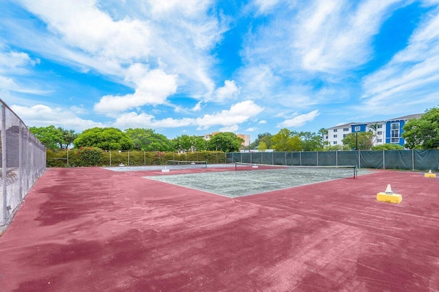 view of tennis court with fence