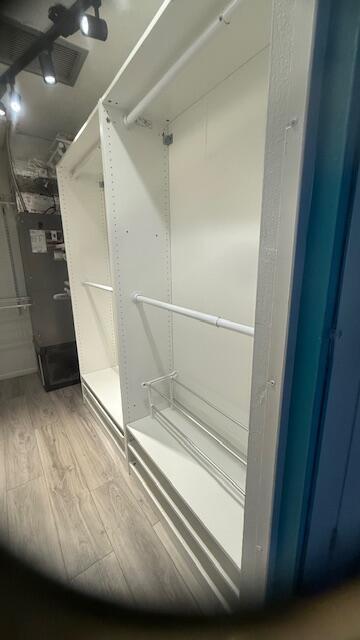 spacious closet featuring wood finished floors