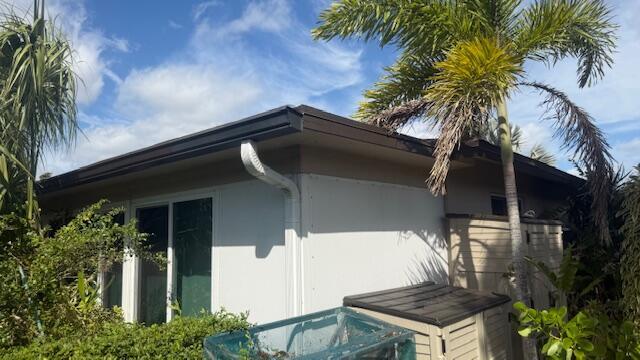 view of side of property with stucco siding